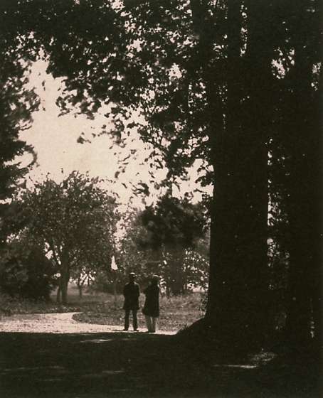 Two Gentlemen on a Road Under Trees