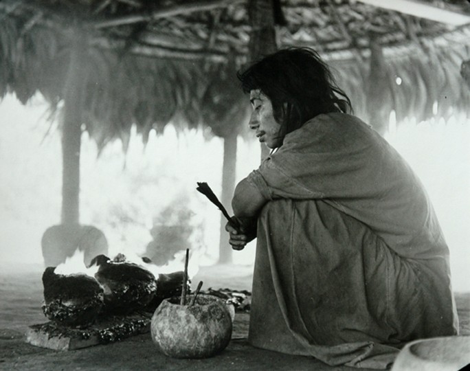 Praying in the god-house while copal incense burns in the pots