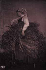 Woman Holding Burden near Wall