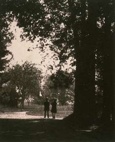 Two Gentlemen on a Road Under Trees