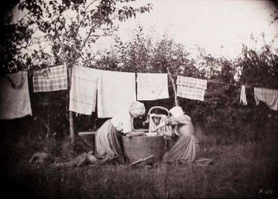 Two women doing laundry