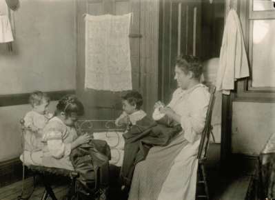 N.Y. tenement. Little ones helped in homework