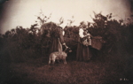 Two Women Standing with Baskets, with Dog